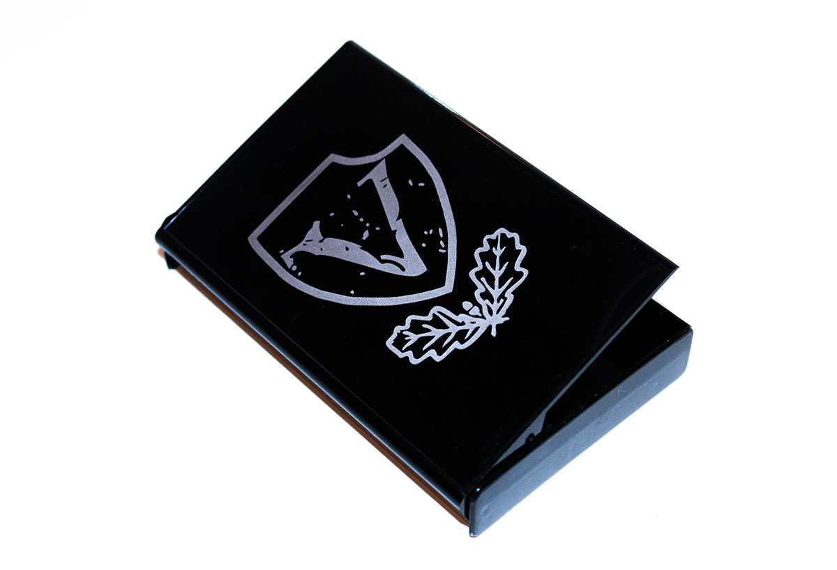 Silver pad print on clear Norelco audio cassette case