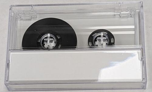 C-66 Transparent W/ Black Hubs (Tabs-IN) with Chrome Tape comes with cassette shell and J-card